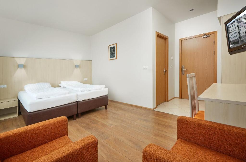 Postel nebo postele na pokoji v ubytování Hotel Klettur