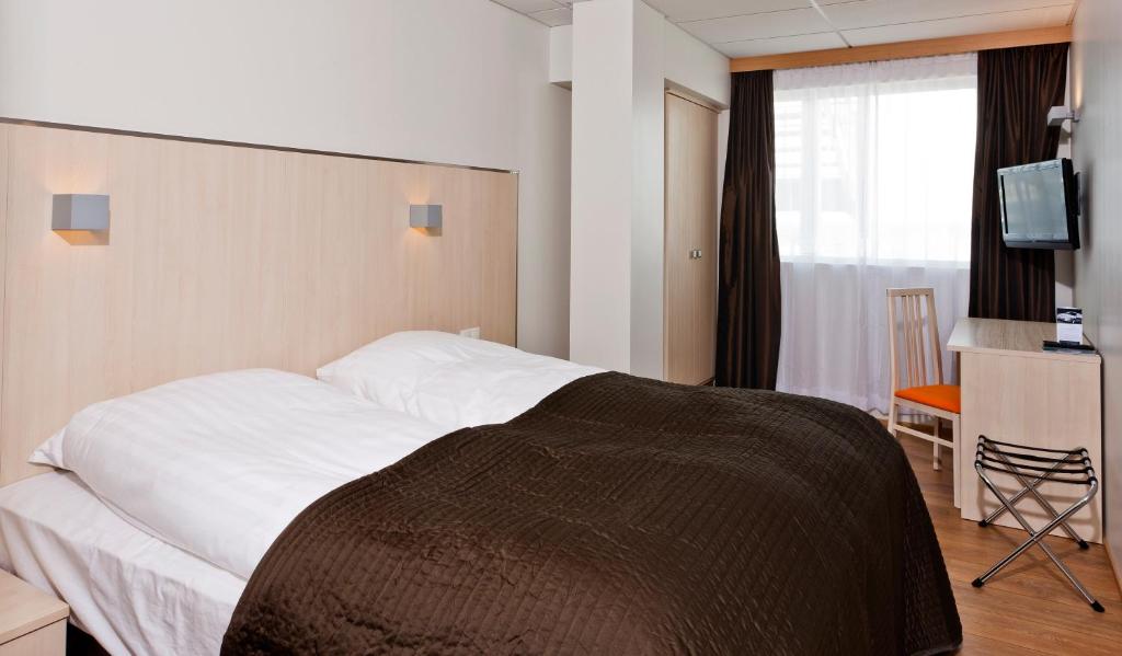 Postel nebo postele na pokoji v ubytování Hotel Klettur