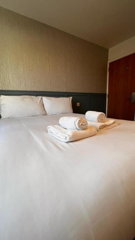Postel nebo postele na pokoji v ubytování Mulligan Hotel