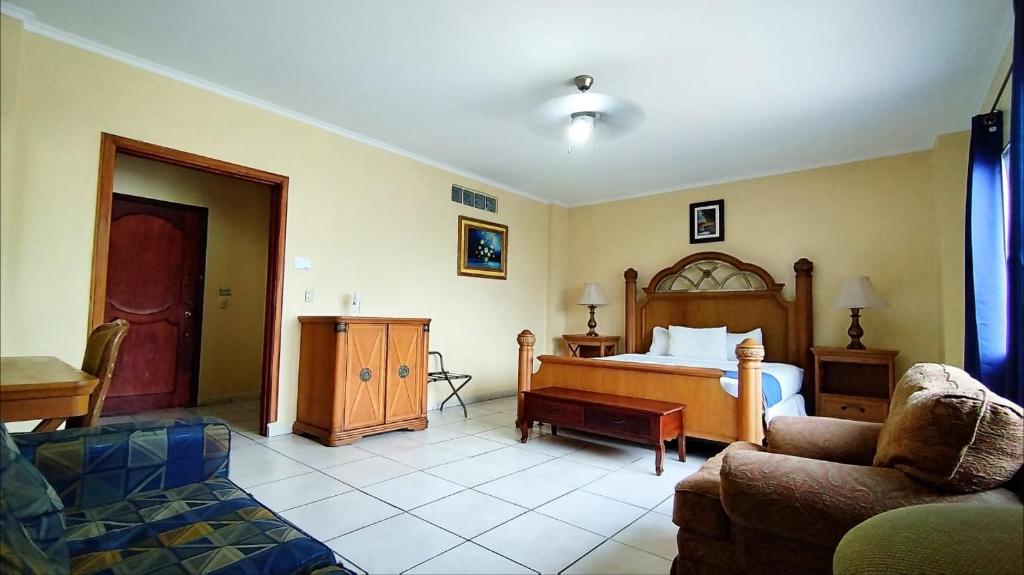 Postel nebo postele na pokoji v ubytování Hotel Carnaval