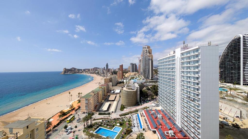 a view of a beach and the ocean and buildings at PINTOR SOROLLA sea front apartment in Benidorm