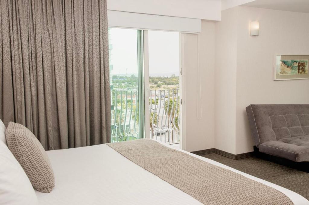 Postel nebo postele na pokoji v ubytování Casa Inn Business Hotel Celaya
