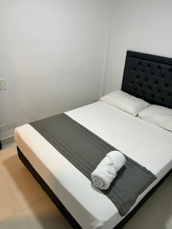 Postel nebo postele na pokoji v ubytování Hotel 79 Poblado