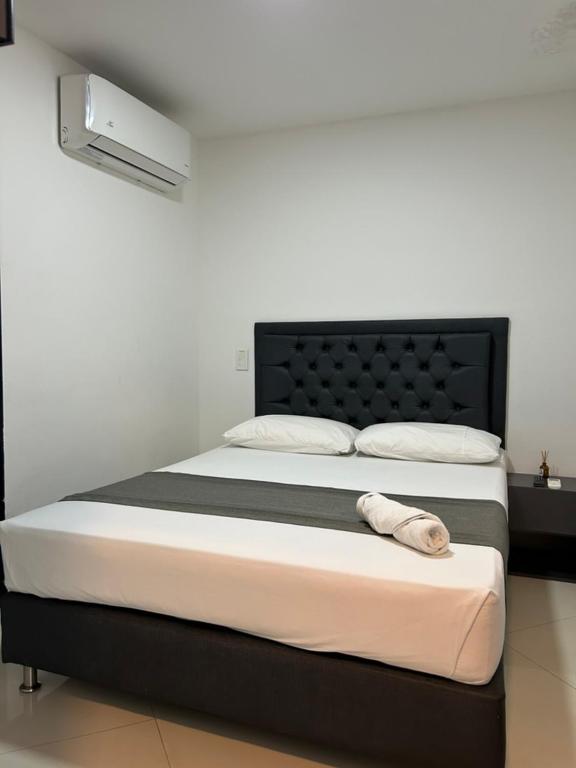 Postel nebo postele na pokoji v ubytování Hotel 79 Poblado