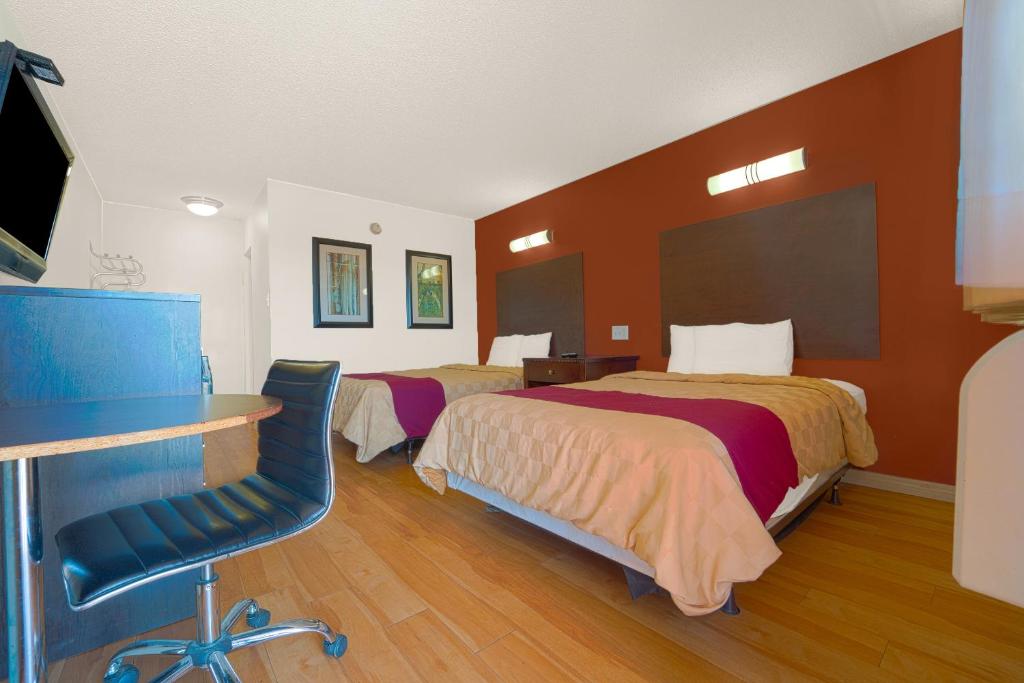 Postel nebo postele na pokoji v ubytování Mojave Hotel