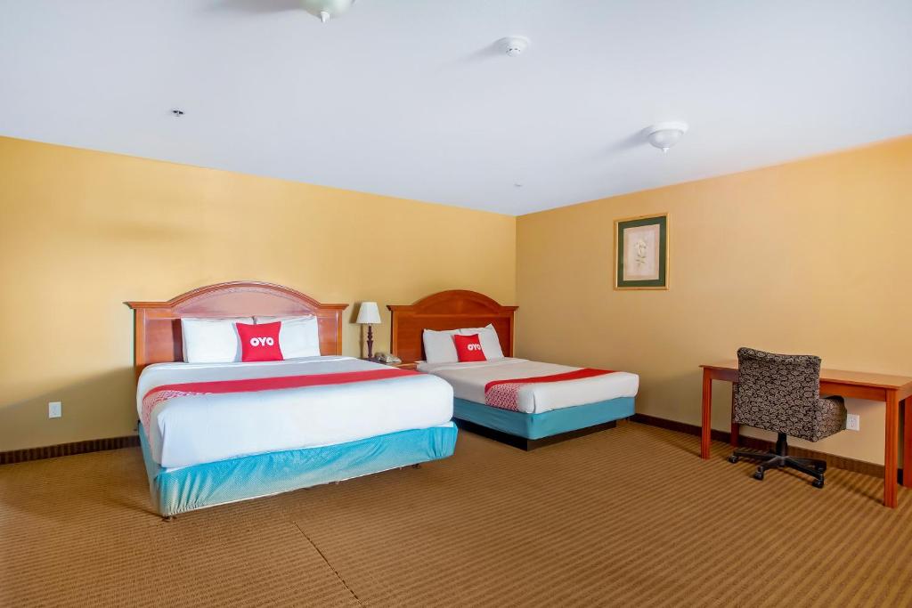 Postel nebo postele na pokoji v ubytování OYO Hotel Jacksboro TX - Fort Richardson