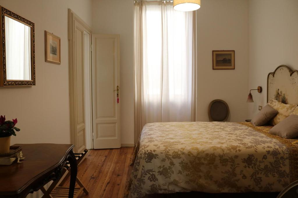 Postel nebo postele na pokoji v ubytování Casa Elli Serbelloni 12
