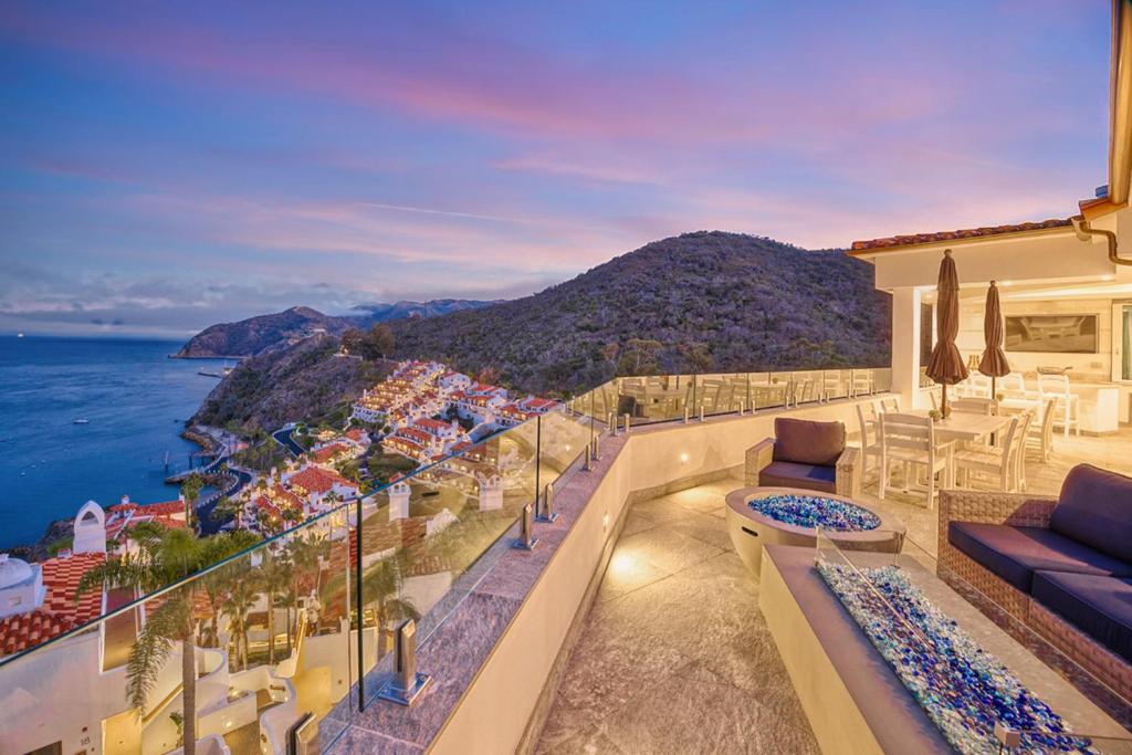 a balcony with a view of the ocean at H208 - The Honeymoon Penthouse Suite Palazzo De Mare in Avalon