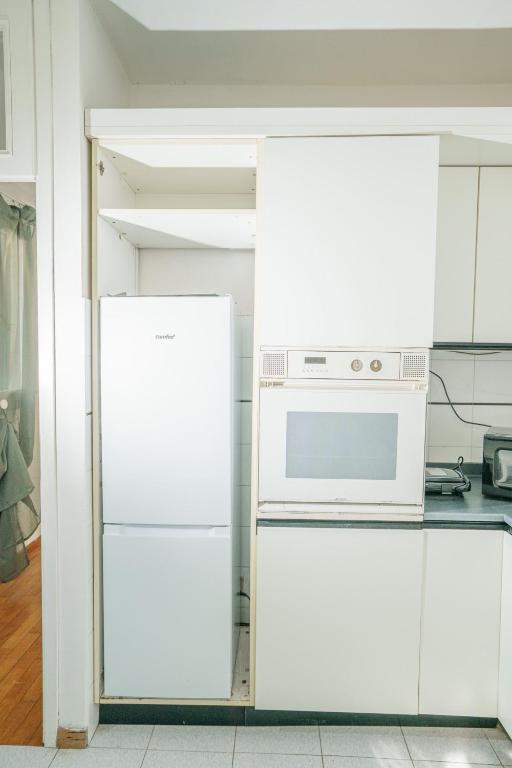 A kitchen or kitchenette at Pretty Apartment Alfani