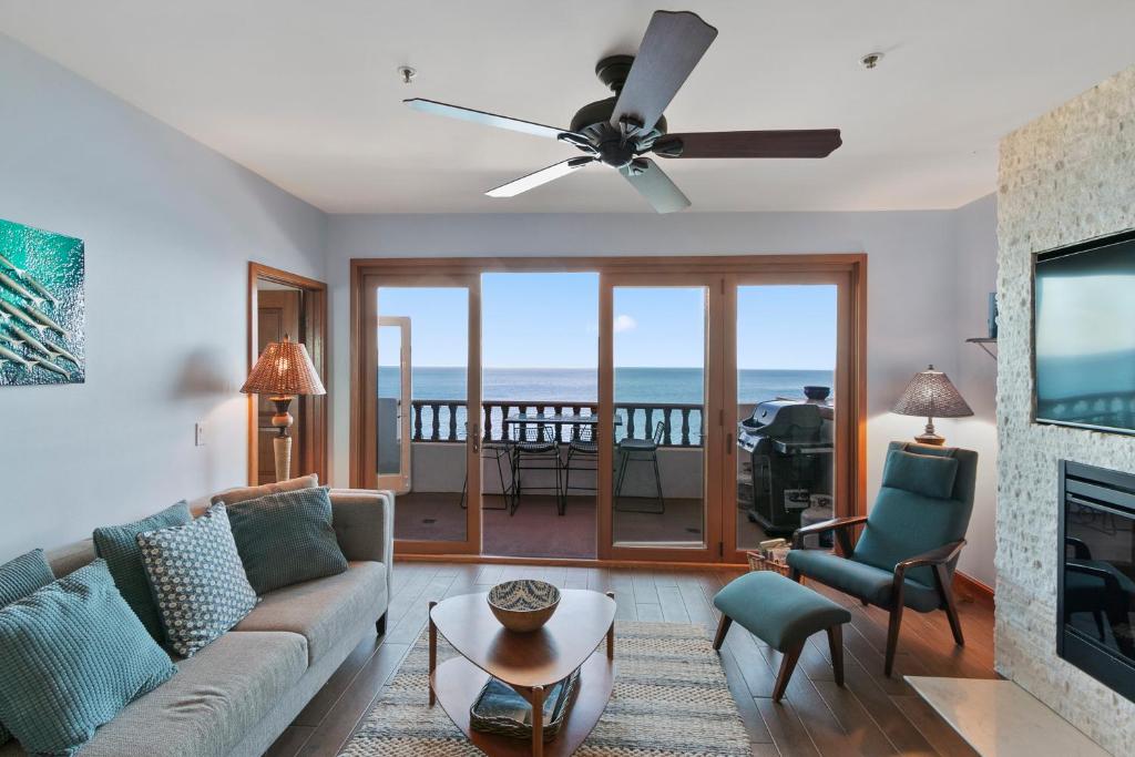 a living room with a couch and a ceiling fan at H248 - Hamilton Cove Villa 2-48 in Avalon