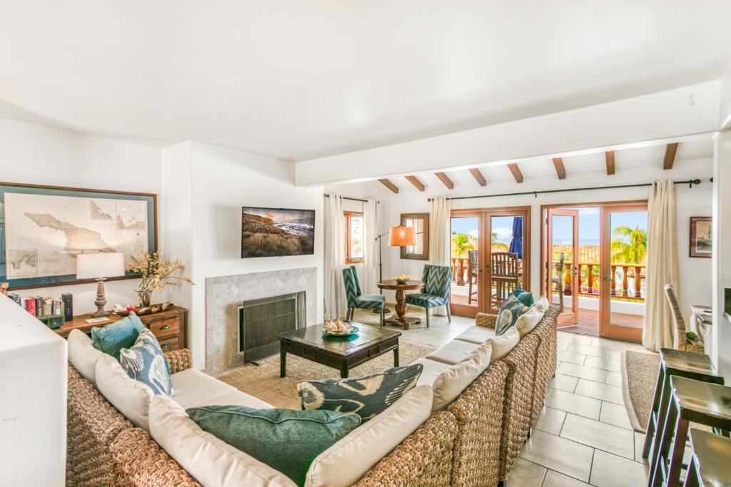 a living room with a couch and a fireplace at H412 - Hamilton Cove Villa 4-12 in Avalon