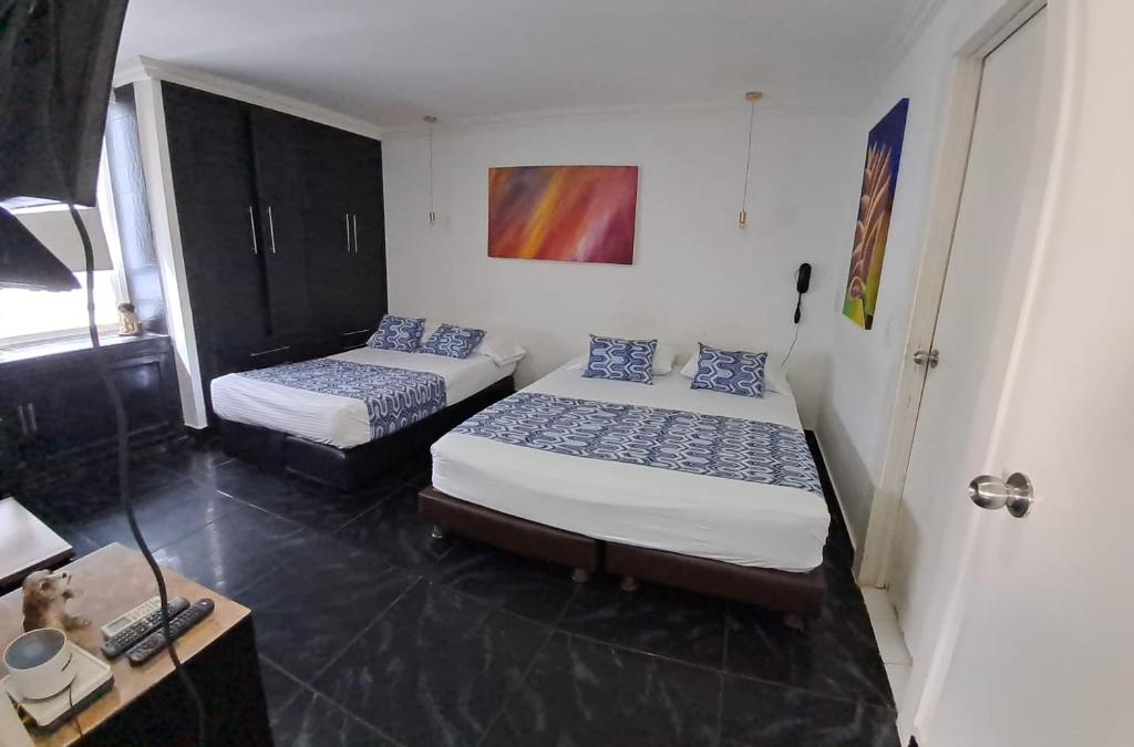 En eller flere senge i et værelse på Apartamento Boutique Cartagena