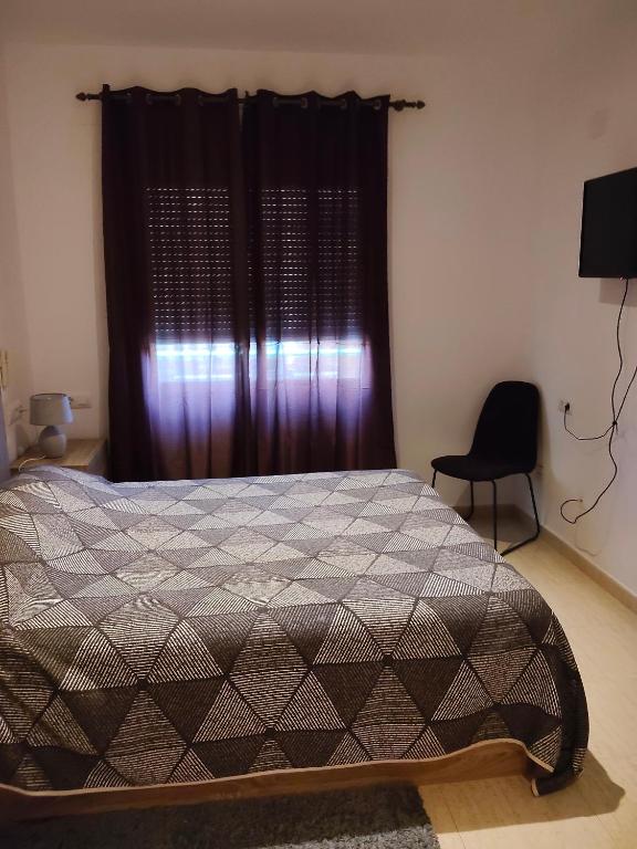 A bed or beds in a room at Relax en la playa