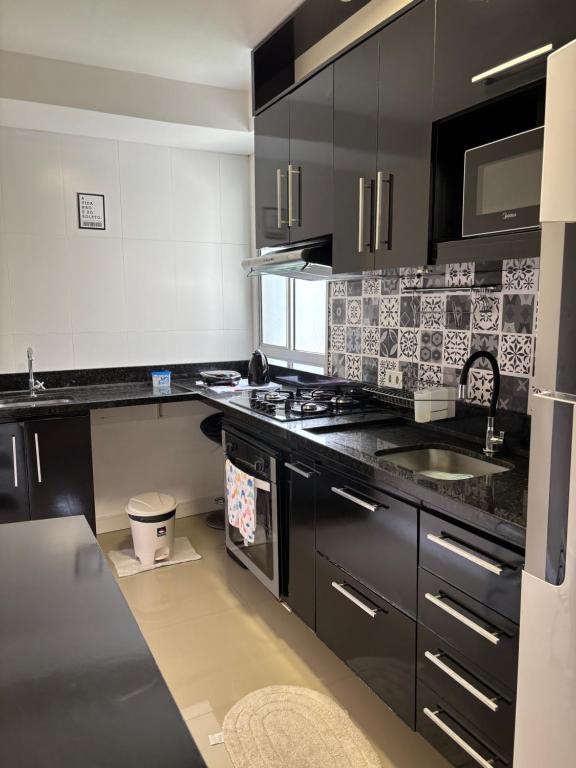 Kuchyň nebo kuchyňský kout v ubytování Apartamento Manaus Aeroporto