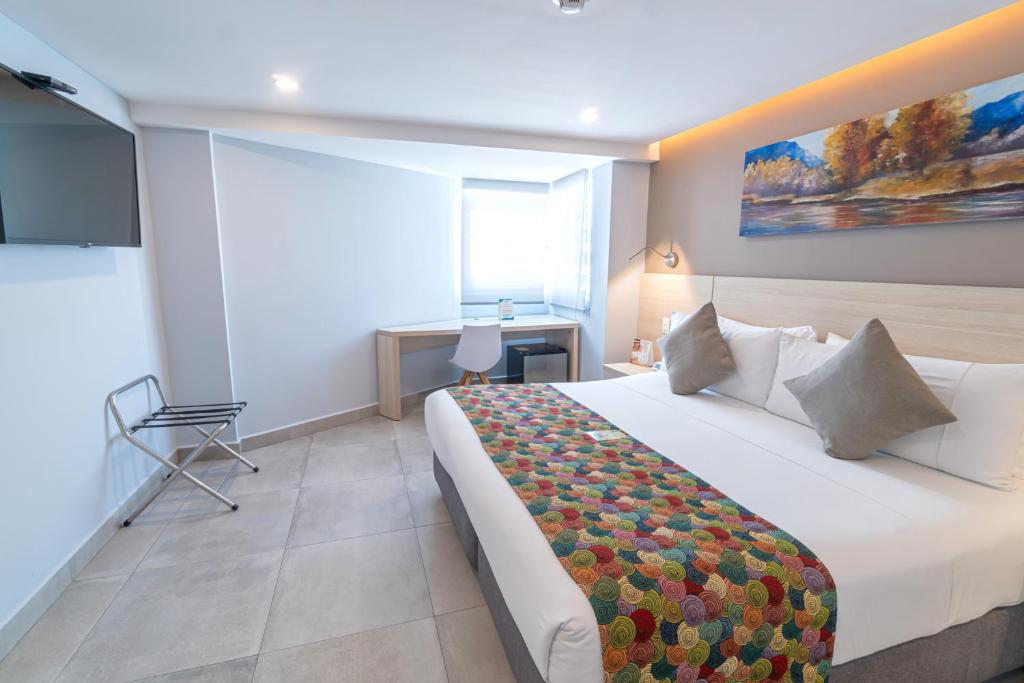 Postel nebo postele na pokoji v ubytování Hotel Barlovento