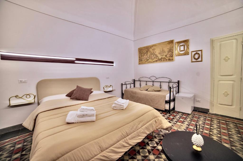 Postel nebo postele na pokoji v ubytování La Corte rooms
