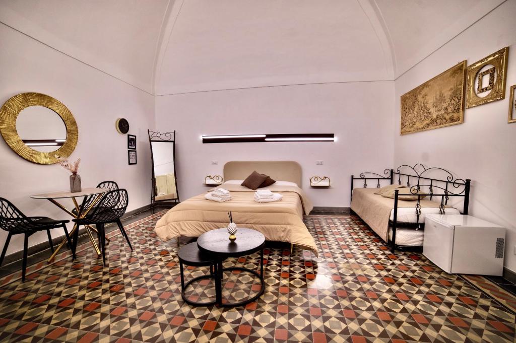 Postel nebo postele na pokoji v ubytování La Corte rooms