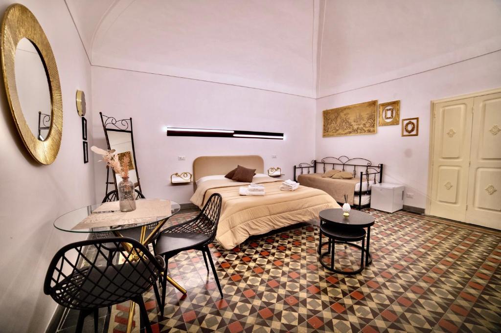 Postel nebo postele na pokoji v ubytování La Corte rooms