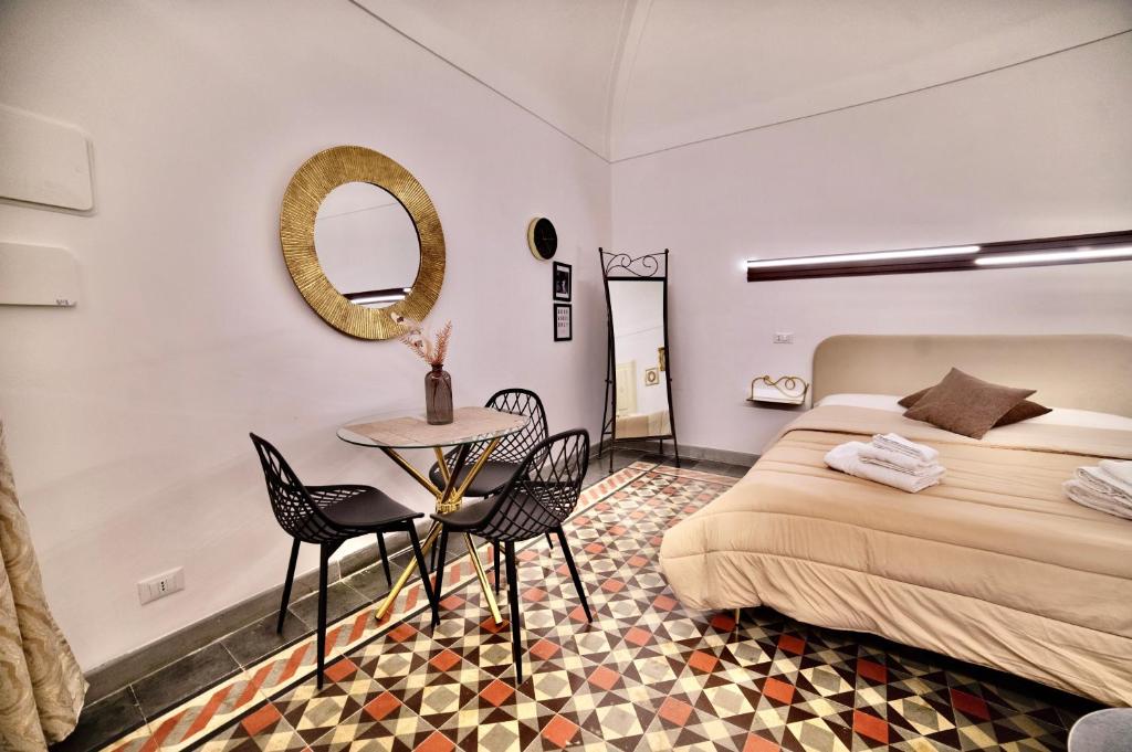 Postel nebo postele na pokoji v ubytování La Corte rooms