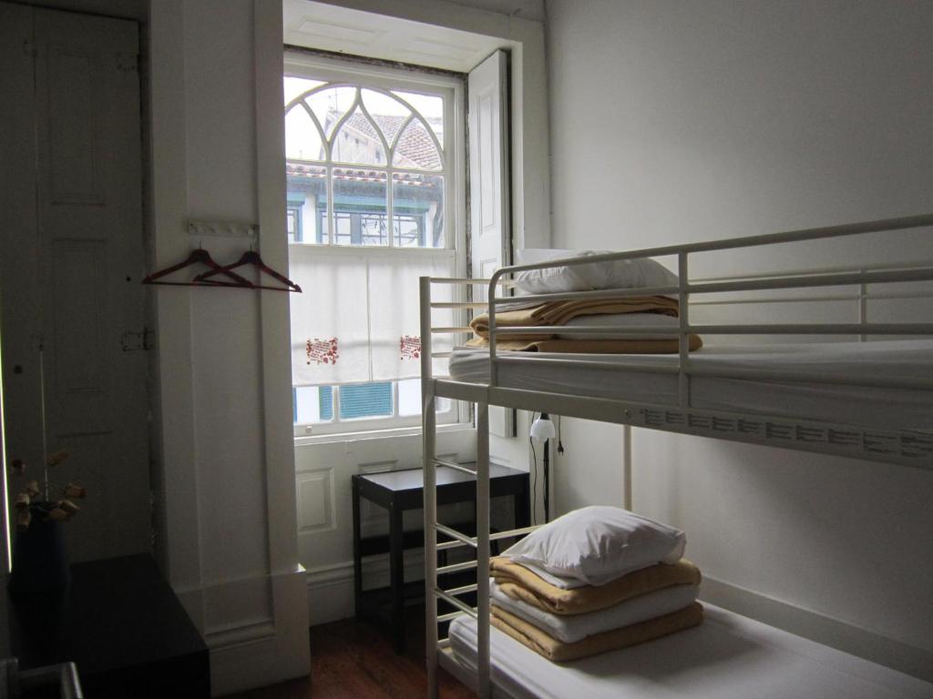 Postel nebo postele na pokoji v ubytování Hostel Prime Guimaraes