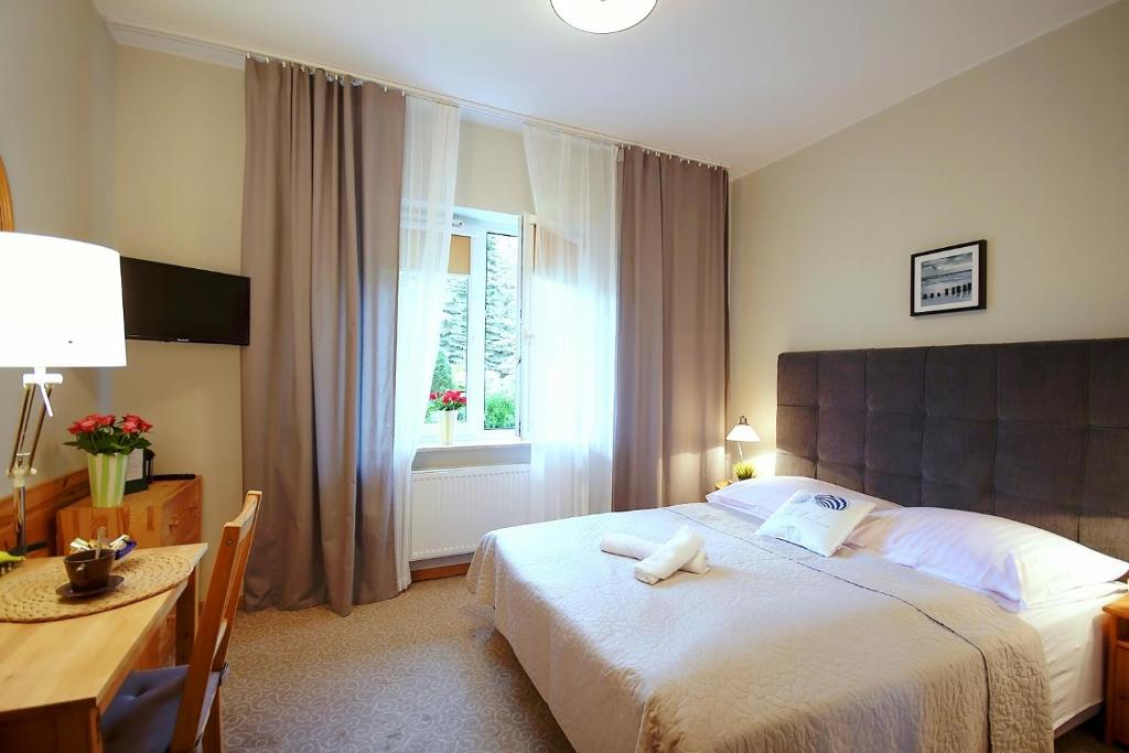 Postel nebo postele na pokoji v ubytování Marmari -Villa dla par