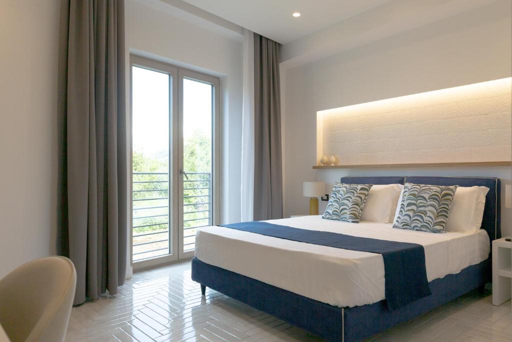 Postel nebo postele na pokoji v ubytování Gioì Hotel Sorrento