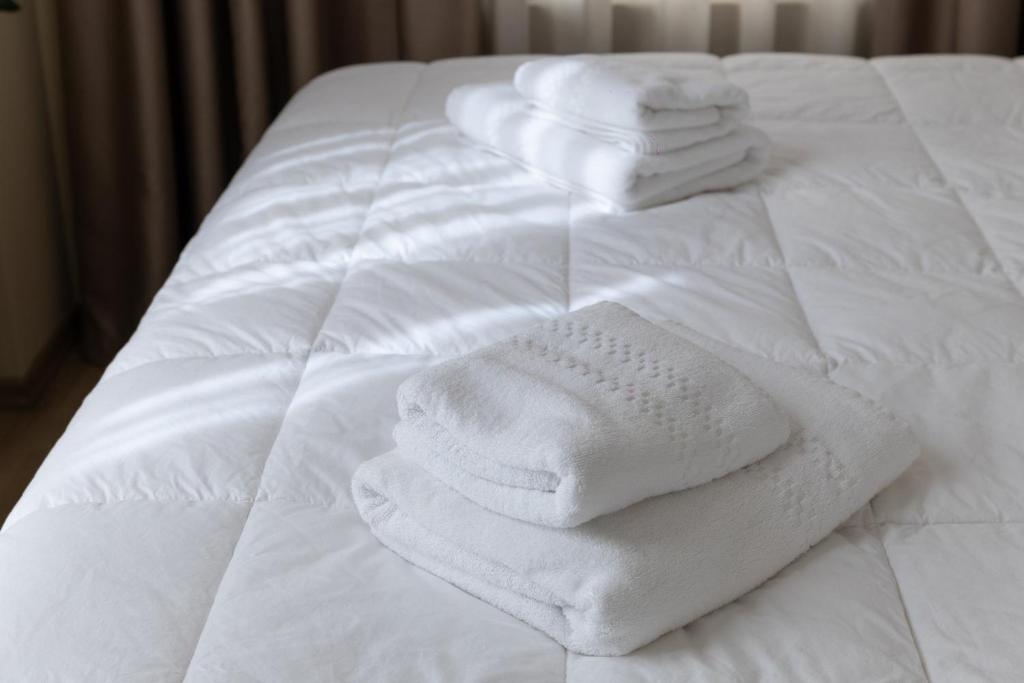 Postel nebo postele na pokoji v ubytování 4R Colombo Hotel