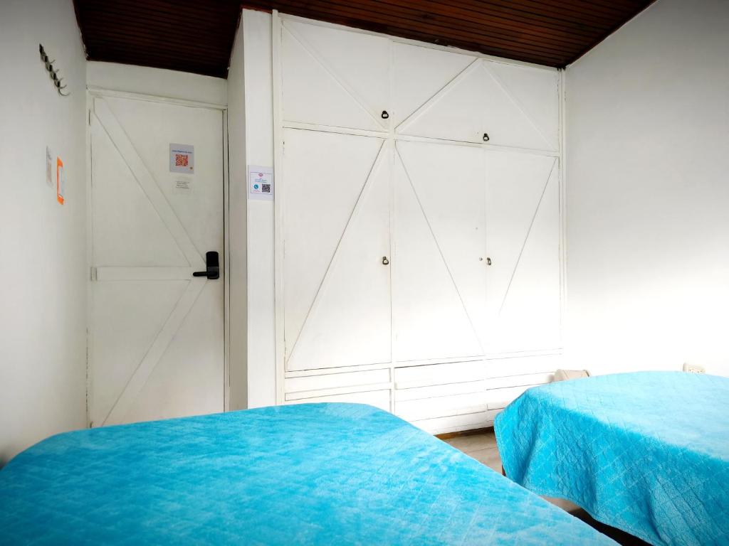 Postel nebo postele na pokoji v ubytování Ayllu Hostel