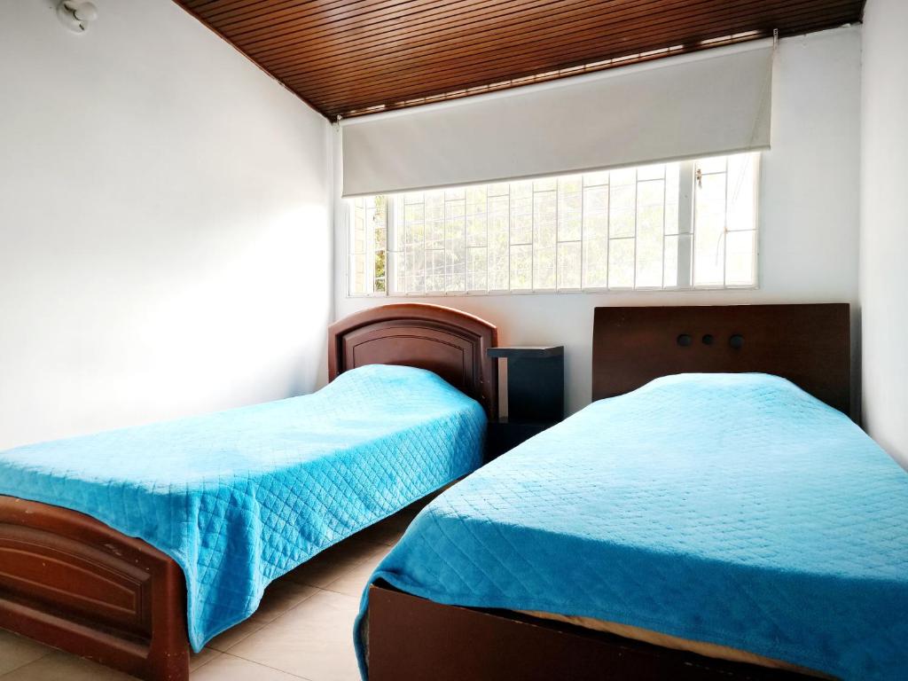 Postel nebo postele na pokoji v ubytování Ayllu Hostel