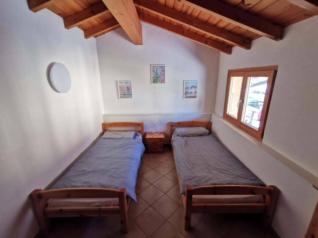 Postel nebo postele na pokoji v ubytování La Pagliera