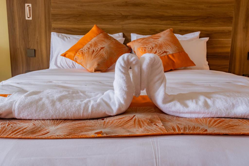 Postel nebo postele na pokoji v ubytování Karen Plains Hotel Nairobi