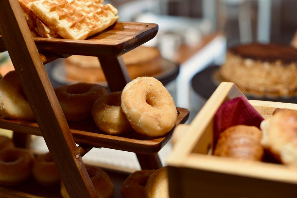 a display of different types of bread and pastries at Palermo Inn Boutique Arte in Palermo