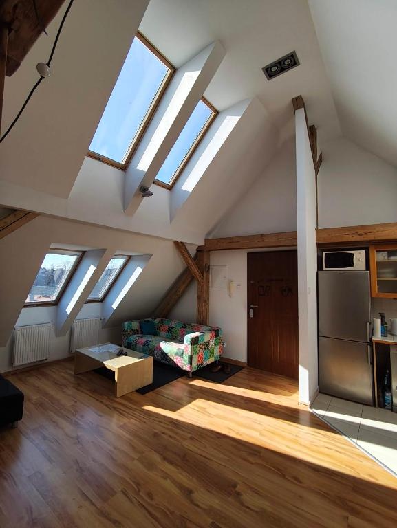 a living room with skylights in a attic at Apartament Gliwice Centrum in Gliwice