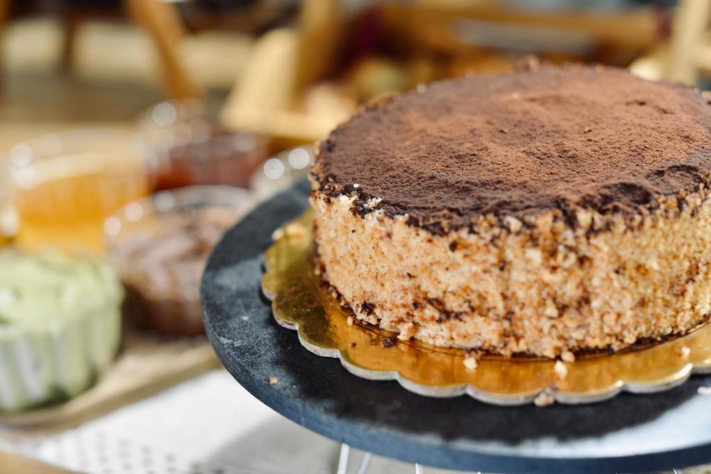 a chocolate cake on a plate on a table at Palermo Inn Boutique Arte in Palermo