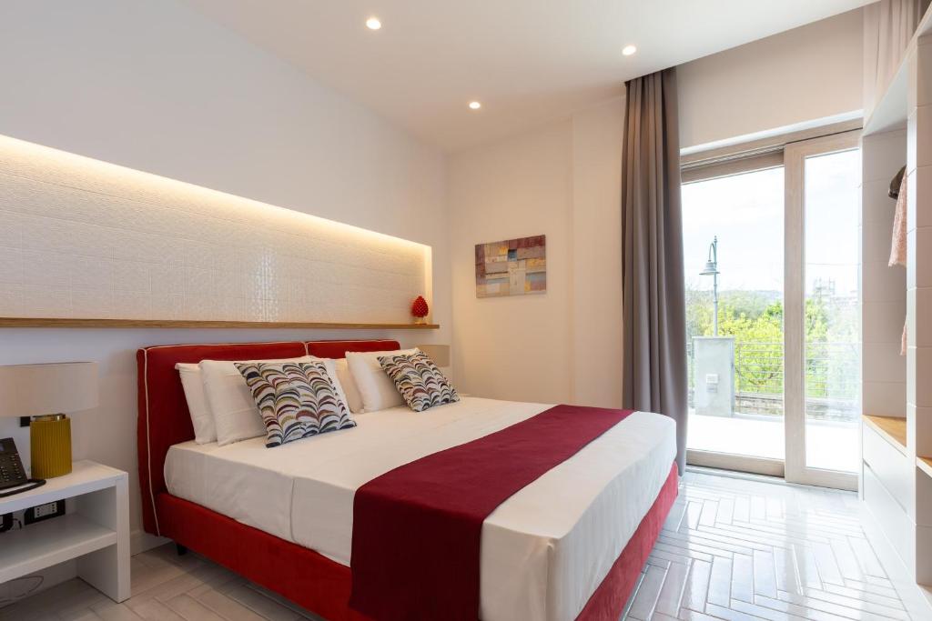 Postel nebo postele na pokoji v ubytování Gioì Hotel Sorrento