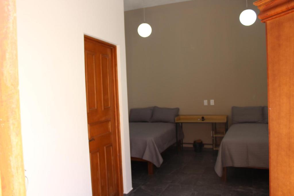 Postel nebo postele na pokoji v ubytování Lofts Sayula Independencia