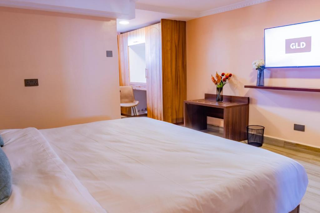 Postel nebo postele na pokoji v ubytování Karen Plains Hotel Nairobi
