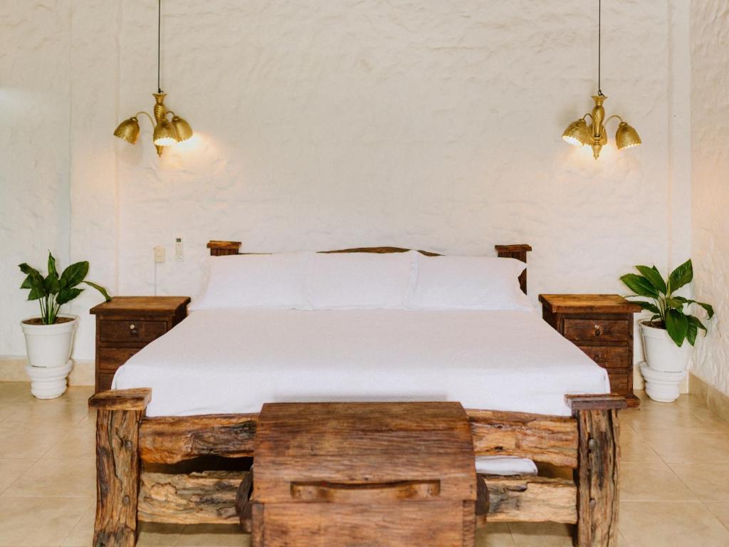 Postel nebo postele na pokoji v ubytování Hotel Kalma