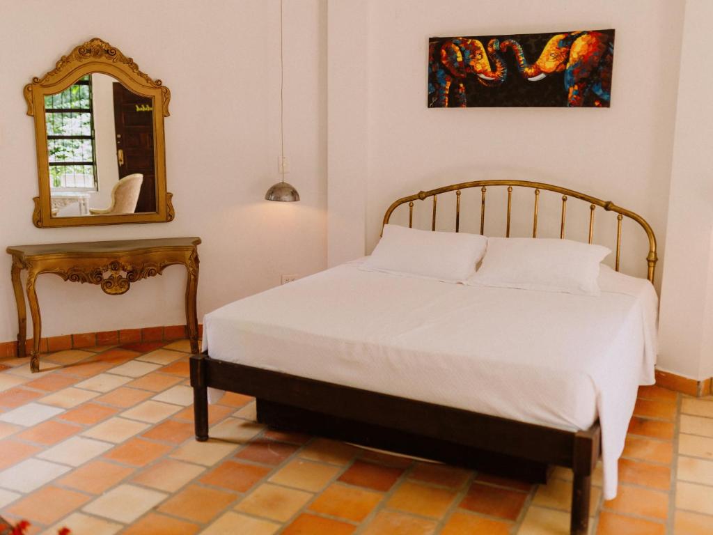 Postel nebo postele na pokoji v ubytování Hotel Kalma