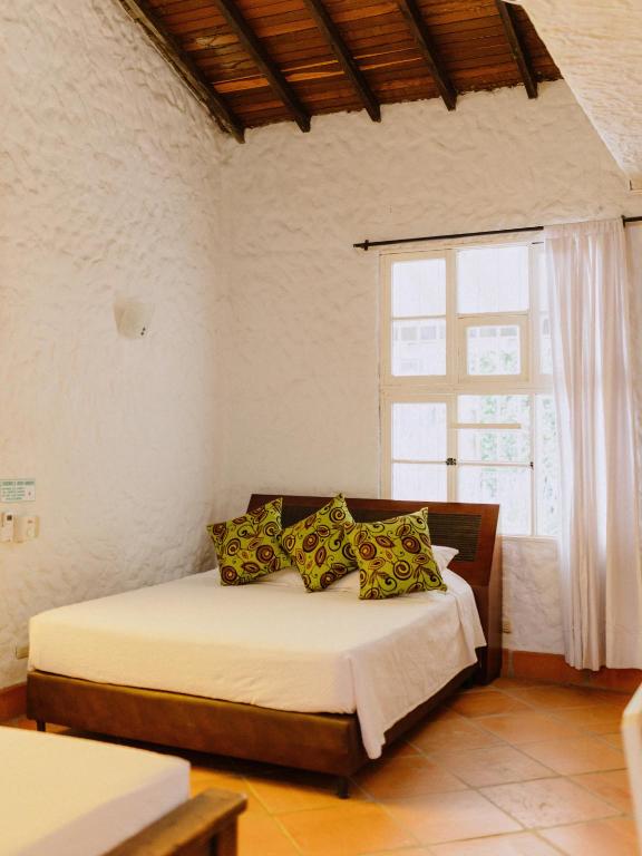 Postel nebo postele na pokoji v ubytování Hotel Kalma
