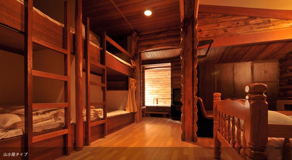Postel nebo postele na pokoji v ubytování Tsubame Highland Lodge燕ハイランドロッジ
