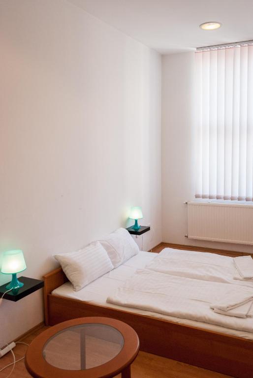 Postel nebo postele na pokoji v ubytování Broadway City Guesthouse