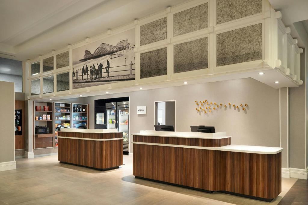 a lobby of a store with two counters at Courtyard by Marriott Long Beach Downtown in Long Beach