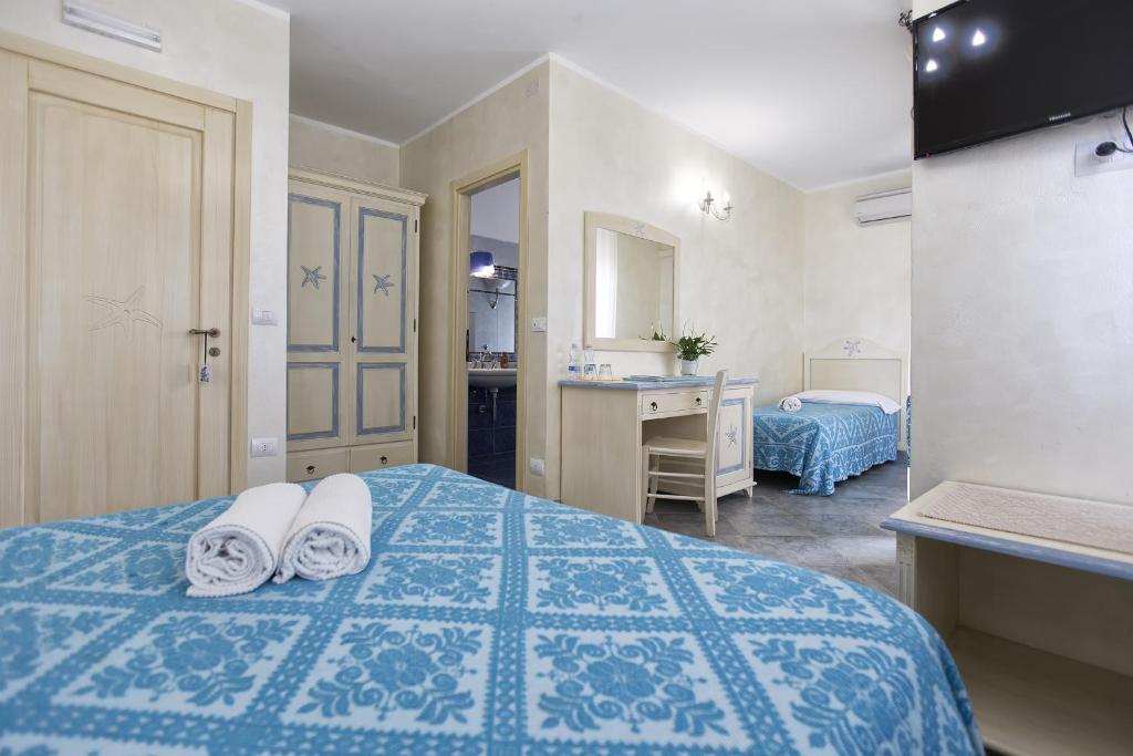 Postel nebo postele na pokoji v ubytování Morpheo Rooms