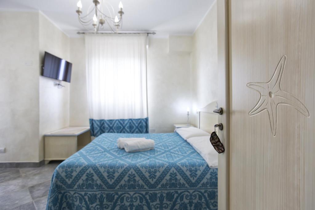 Postel nebo postele na pokoji v ubytování Morpheo Rooms