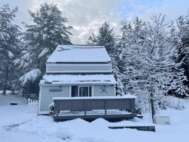 a house with snow on the top of it at 43TV peaceful retreat in the White Mountain fireplace fire pit large yard WiFi AC in Carroll