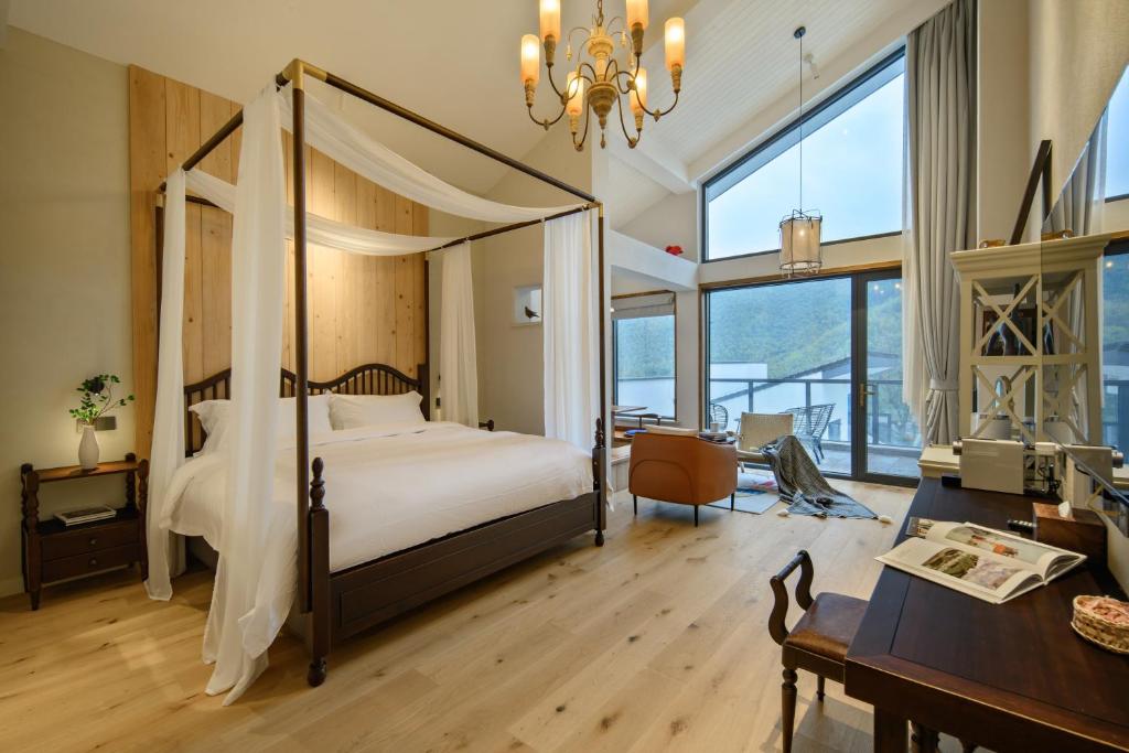 Postel nebo postele na pokoji v ubytování Moganshan Xinyuanju Homestay