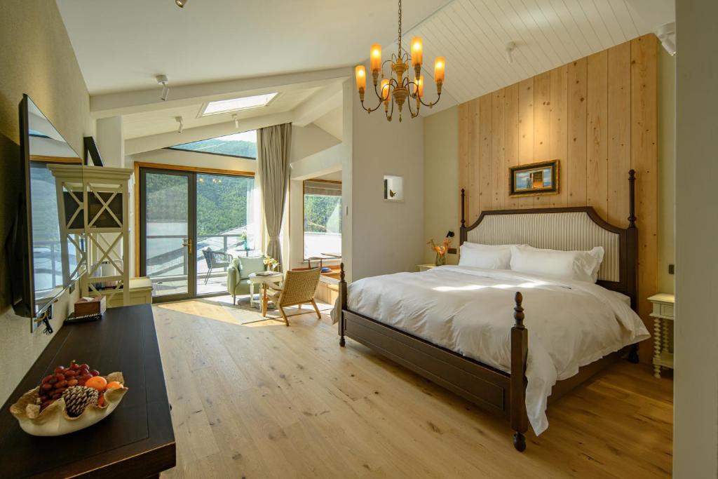 Postel nebo postele na pokoji v ubytování Moganshan Xinyuanju Homestay