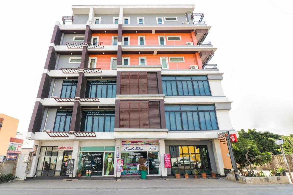 an orange and white building on a city street at King One Suvarnabhumi in Bangkok