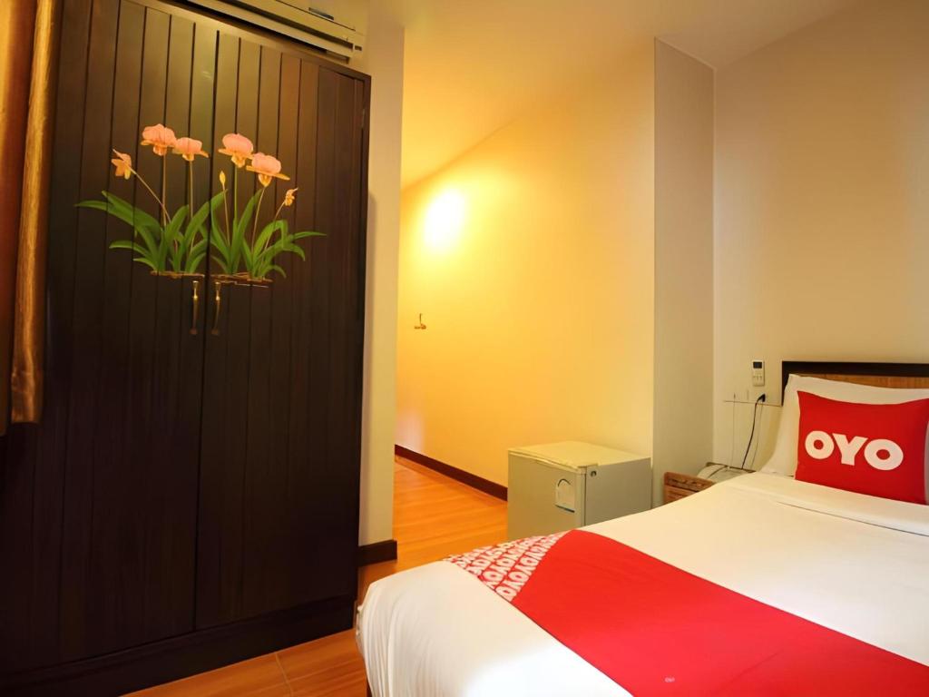 Postel nebo postele na pokoji v ubytování Pannee Lodge Khaosan - SHA Plus